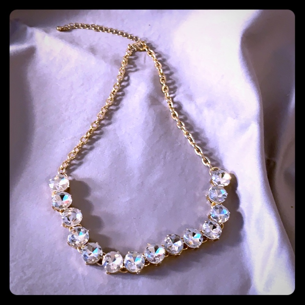 Gold tone with clear gems 8”.